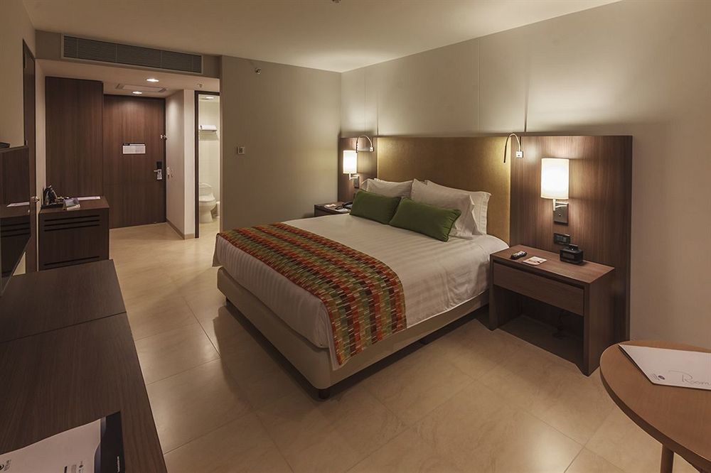 Estelar Villavicencio Hotel & Centro De Convenciones Kültér fotó A room at the hotel